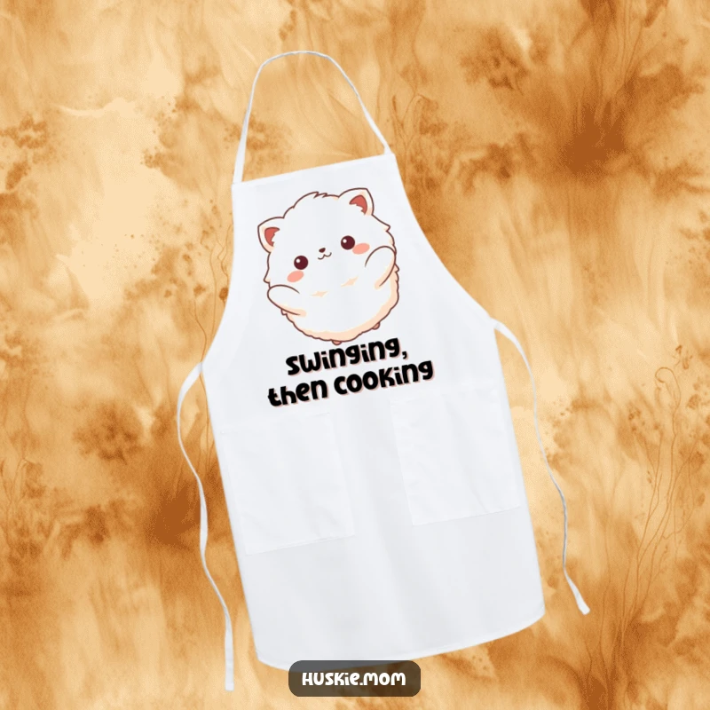 Funny apron showing a fluffy animal with a serene smile, peacefully swinging back and forth, bringing a calm vibe to the kitchen.