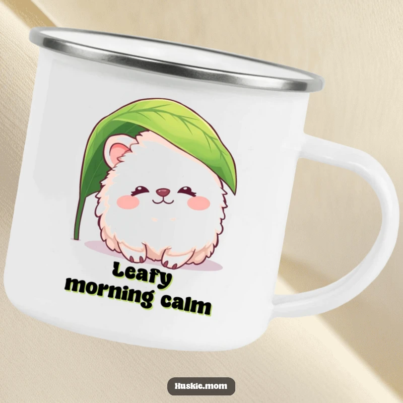 Funny fluffy animal camping mug showing a creature peacefully peeking from under a leaf, perfect for enjoying drinks with gentle humor.