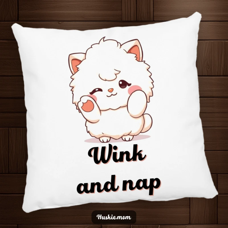 Funny fluffy character winking and gesturing with a paw, on a soft pillow for humorous comfort and cute decor.