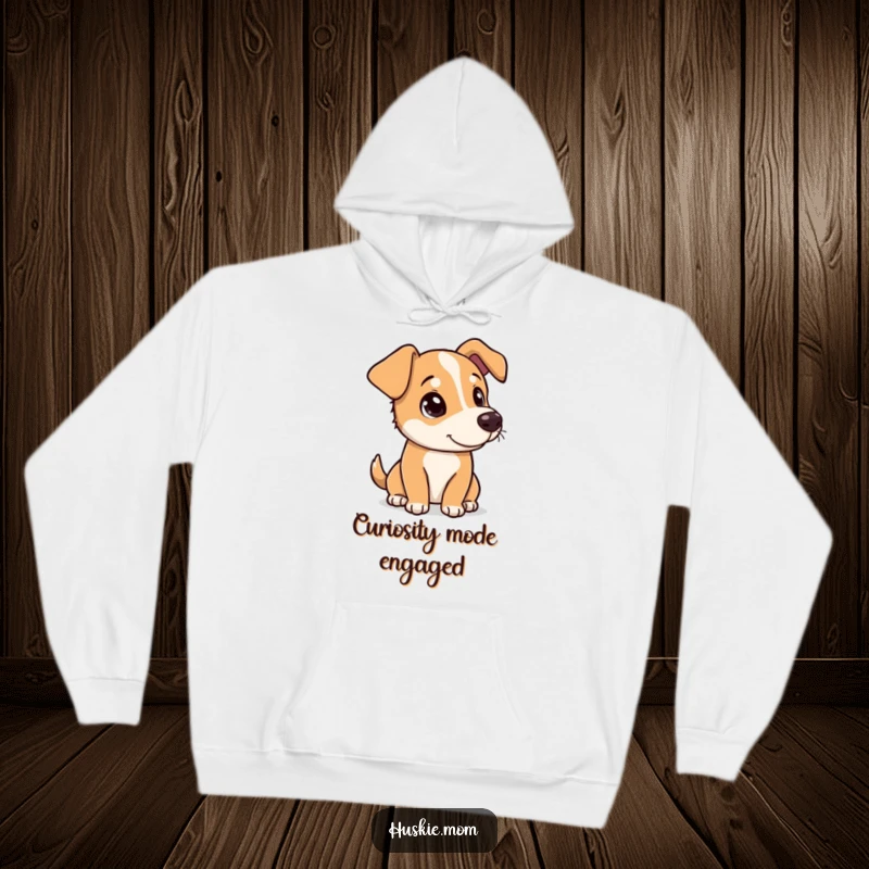 Funny dog tilting its head with a curious, playful look on a cozy hoodie, radiating adorable charm.