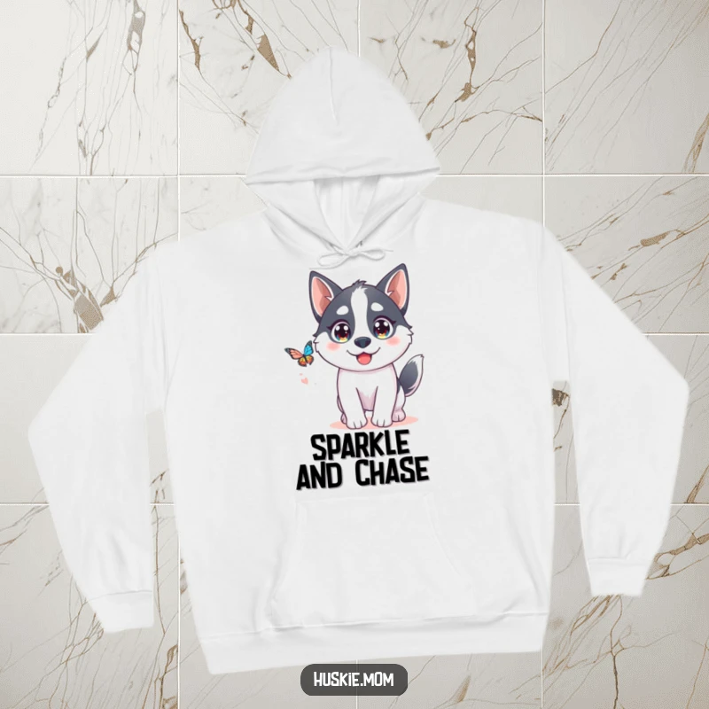Funny Kawaii Husky Hoodie: A cute husky with sparkling eyes playfully chases a butterfly, offering cozy humor.
