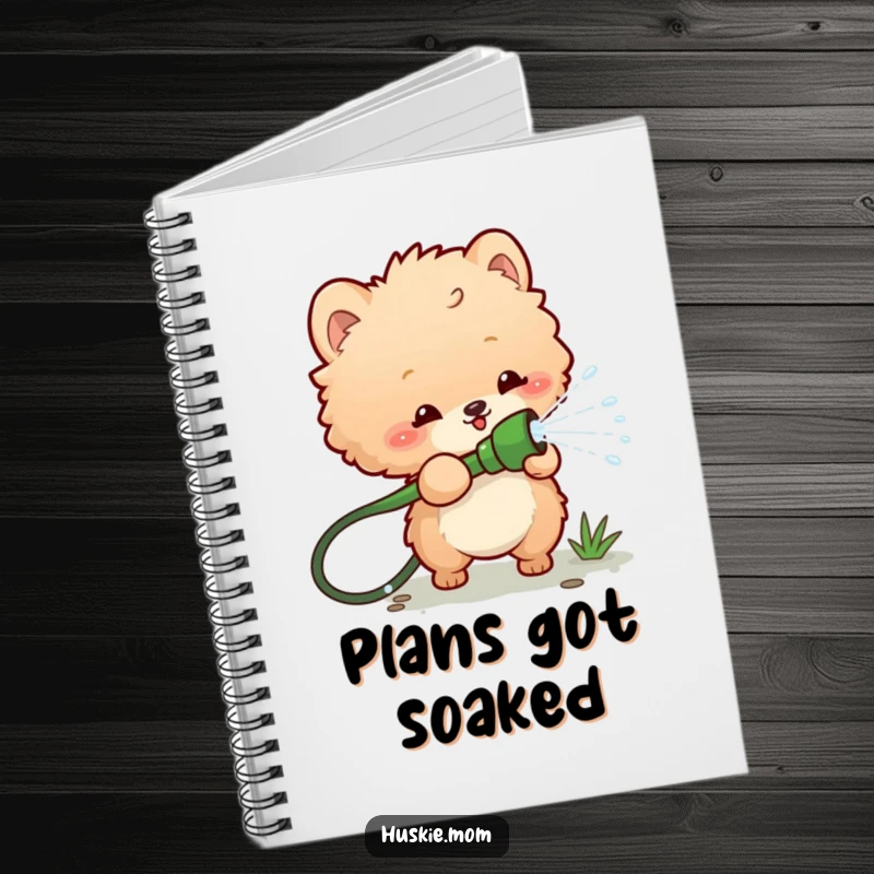 Funny notebook with a cover featuring a fluffy animal playfully spraying water from a garden hose, perfect for jotting down ideas with humor.