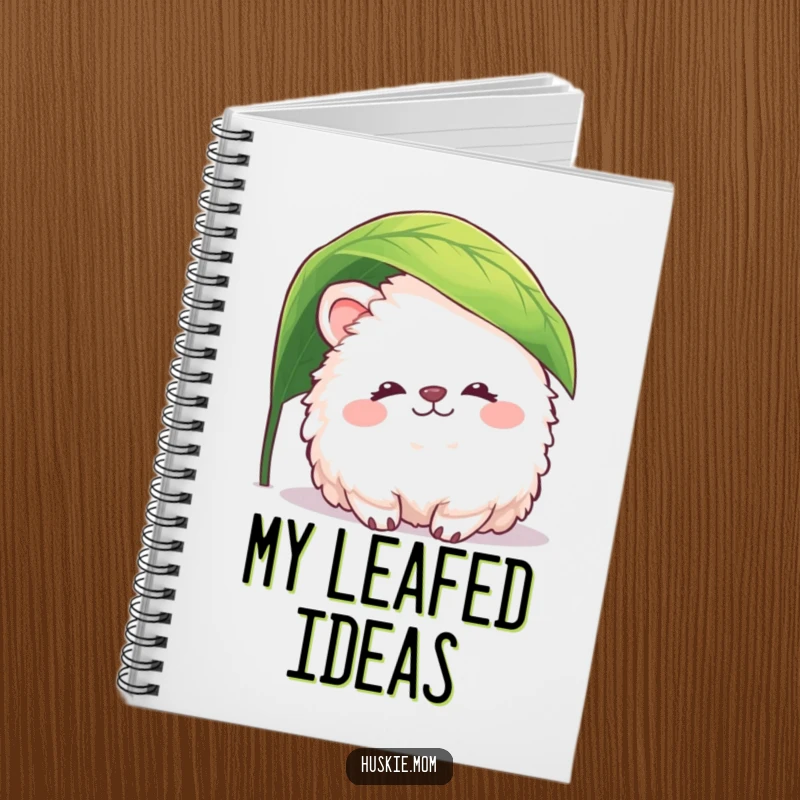 Funny fluffy animal notebook with a peaceful creature peeking from under a leaf, perfect for journaling with gentle humor and serenity.
