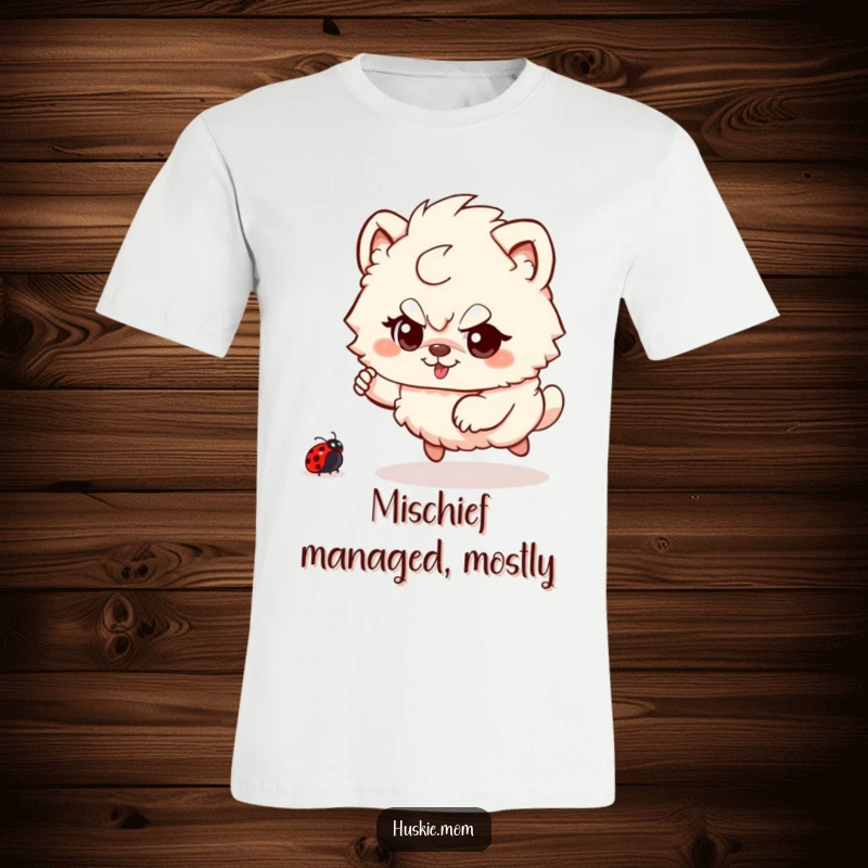 Funny Fluffy Animal T-Shirt: A depiction of a fluffy creature with a playful glint, joyfully pursuing a ladybug in an outdoor setting.