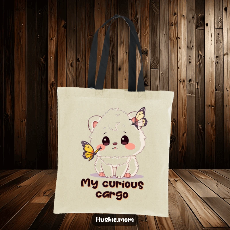 Funny tote bag with a fluffy animal curiously watching a butterfly, perfect for carrying essentials with a dose of whimsical charm.